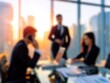 © Johannes - business team virtual call on a blured office background with natural sunlight