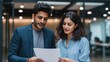 © Anat art - South Asian Tech Worker Reviews Work Authorization Documents With Corporate Immigration Attorney in Modern Office Setting
