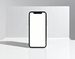 © 海 春 - 白い画面のスマートフォンモックアップ。現代的なテクノロジーとデジタルコミュニケーションを表現するミニマリストな携帯電話ディスプレイ。