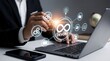 © Navi Pix - Business professional interacting with devops workflow on a laptop and mobile device