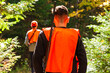 © Martin - Young hunters scouring a forest trail in autumn in search of prey