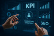 © iPhoto - Hands Using KPI Marketing Strategy Dashboard with SEO and Analytics Charts