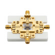 © Totomonk - Gold plated microwave connector quantum computing components precision test fixture showing metal contacts ceramic base and delicate wiring