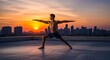 © Hitendra - A fit man practicing yoga on a rooftop during a vibrant sunset over the city