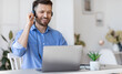© Prostock-studio - Hotline Operator. Handsome Man Customer Support Manager In Headset Working With Laptop Computer In Office, Consulting Clients Online, Managing Issues, Sitting At Desk, Free Space