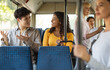 © Prostock-studio - Public Transportation. Portrait of smiling African American young woman and Asian guy taking bus sitting on seat together, talking, enjoying travel or ride on public vehicle having conversation