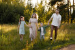 © Kaplitskaya Love - Active Family Enjoying Fitness Adventure During Evening Hours Outside. Caucasian Family Engaging In Energetic Jog Along Rural Path At Sunset With Lively Shadows And Health Focus