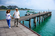 © Akarawut - Senior asian couple are traveling the world using their sailing luxury vessel ship in the summer for retirement lifestyle and actively healthy lifestyle and happiness longevity concept