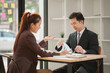 © aekachai - Professional Asian Businesswoman Conducting an Interview or Meeting in a Modern Office