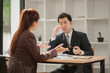 © aekachai - Professional Asian Businesswoman Conducting an Interview or Meeting in a Modern Office