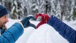 © savittree - Romantic couple making heart shape with hands in snowy forest during winter season, showcasing love and connection in nature