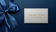 © MD ALIF KHAN - A white gift card with a blue ribbon on a dark blue background for seasonal greetings and presents