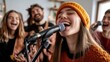 © aref - Joyful young woman in orange hat singing with band at home rehearsal