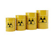 © RAZIA - Four yellow radioactive waste barrels in increasing size, isolated on transparent background