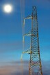© a40757se - Night shot of moon with electric powerline pylon