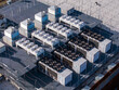 © AmazingAerialAgency - Aerial view of a data center with multiple hvac cooling systems for server and compute grid infrastructure, Warsaw, Masovian Voivodeship, Poland.