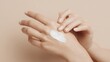 © Viktoriia - Elegant female hands with moisturizing cream on smooth skin