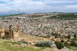 © Moritz Wolf/imageBROKER - City view, Fez with city wall, University Al Quaraouiyine, behind it green hills, Fes, Morocco