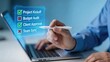 © Sophie - Businessman Using Holographic Checklist On Laptop Screen For Project Management Budget Audit Client Approval And Team Sync Digital Task List Workflow Optimization Corporate