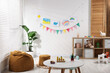 © New Africa - Stylish child's room with furniture, toys, beautiful drawings and bright flags. Interior design