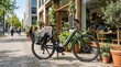 © VisionStock - Modern electric bicycle parked on sunny city sidewalk, black e-bike with pannier bag outside cozy cafe, urban sustainable transportation and lifestyle