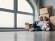 © Daniel - An older couple sits on the floor embracing beside stacked moving boxes and a large arched window, sharing a peaceful, happy moment as they settle into their new home after relocating together.