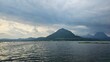 © Gianti - A tranquille view of serene lake surrounded by mountains and beautifull  blue sky and cloud.