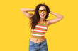 © Pixel-Shot - Beautiful African-American woman with sunglasses on yellow background