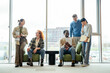 © Miljan Živković - Diverse business team collaborating in informal office meeting