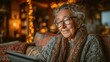 © Andreas - Older woman uses a tablet at home with warm lights