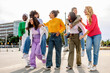 © Xavier Lorenzo - Diverse group of young women having fun walking outdoors together. Lively friends enjoying a walk full of laughter and happiness. Friendship and diversity concept.