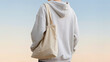 © Sandra - Casual Young Adult with Tote Bag from Behind