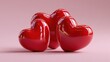 © Ball - Three Red Hearts: A trio of glossy, crimson hearts, symbols of love and affection, come together against a soft backdrop, celebrating the warmth of human emotion.