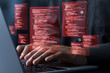 © tadamichi - Hackers exploit vulnerabilities in source code to launch cyberattacks. Hacking and cybercrime concept.