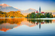 © ecstk22 - Bled, Slovenia. Sunrise water reflection on iconic Lake Bled