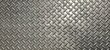 © Pisan - The diamond plate  also known as tread plate or checkered steel plate. which is a type of metal stock with a regular pattern of raised diamonds or lines on one side.