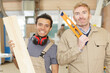 © auremar - woodwork studio workers holding pieces of wood