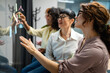 © Miljan Živković - Diverse women collaborating on innovative sticky note ideas