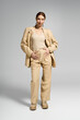 © LIGHTFIELD STUDIOS - Elegant woman showcasing contemporary fashion in a chic studio setting