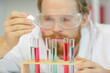 © auremar - close view of male scientist using pipette