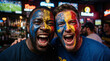 © Guillotine - Two passionate diverse male football fans with colorful face paint screaming with excitement in a dim bar