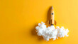 © theshooter - Cohete de cartulina con humo de algodón sobre fondo amarillo, ideas, emprendimiento, innovación, startups marketing, tecnología, crecimiento, imaginación y exito en desarrollo de proyectos