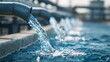 © Momin Photo Gallery - Clean water flowing from metal industrial pipes at water treatment facility