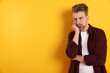 © New Africa - Resentful man on yellow background. Space for text