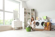 © Pixel-Shot - Shocked young woman sorting dirty clothes in laundry basket at home