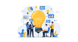 © Rizky - Business Team Collaborating Around Giant Light Bulb Idea.