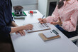 © Phimwilai - Real estate agent explaining contract clauses to client