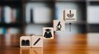 © MUHARDING - Blocks with education symbols rising to knowledge on a wooden desk in a library