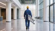 © olga_demina - Professional Tradesman Carries Ladder Through a Bright Modern Office Lobby Symbolizing Readiness for Service Efficiency and the Seamless Integration of Essential Maintenance into Contemporary Business