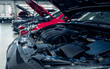© Fahroni - Auto repair shop. Cars open bonnet parked in garage for repair and maintenance service. Car check up at service station. Car waiting for inspection in auto repair shop. Car maintenance and checklist.